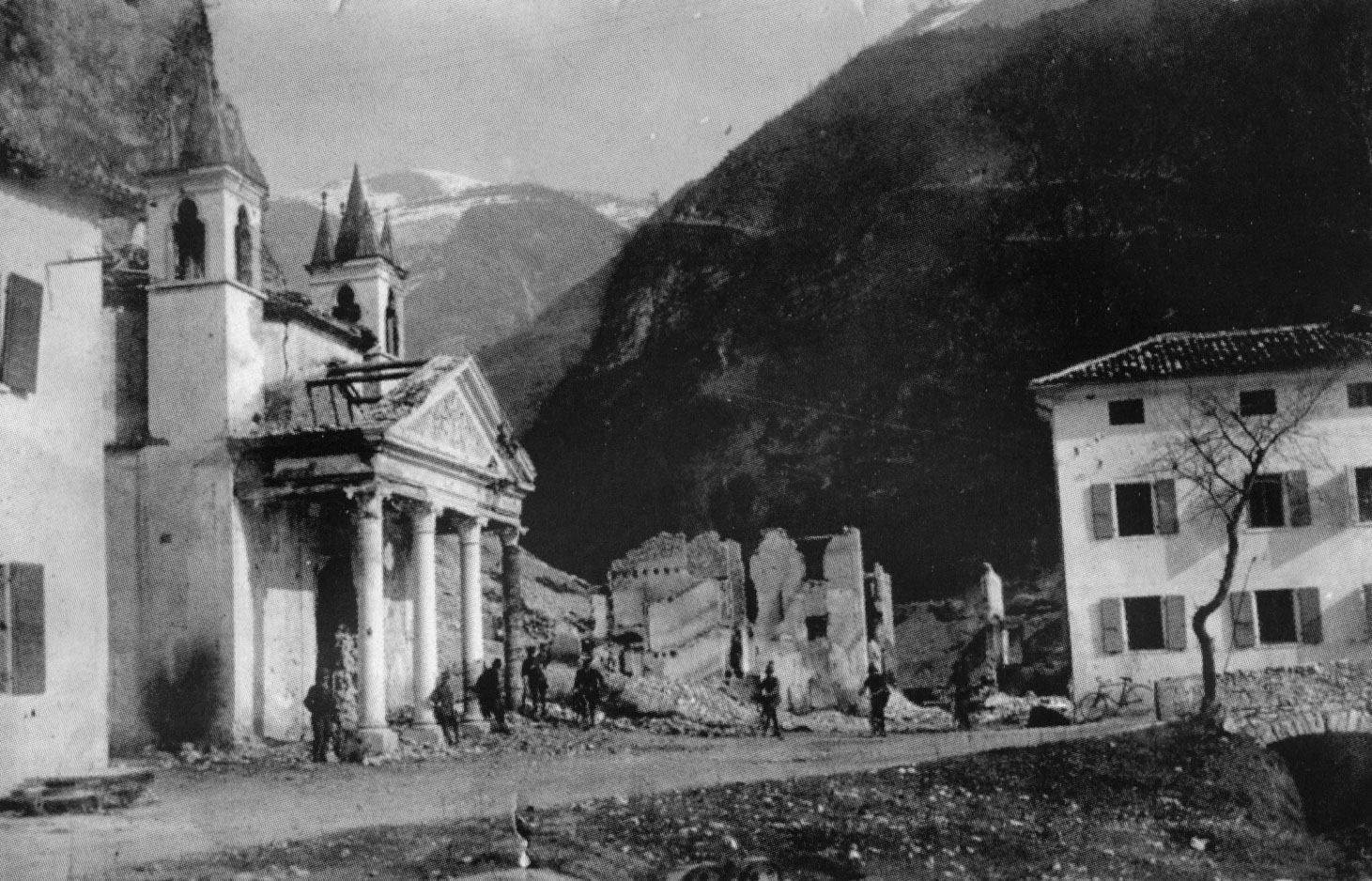 Austrian soldiers stationed by the crumbling chapel of Pedancino with ruined buildings in the background during World War I