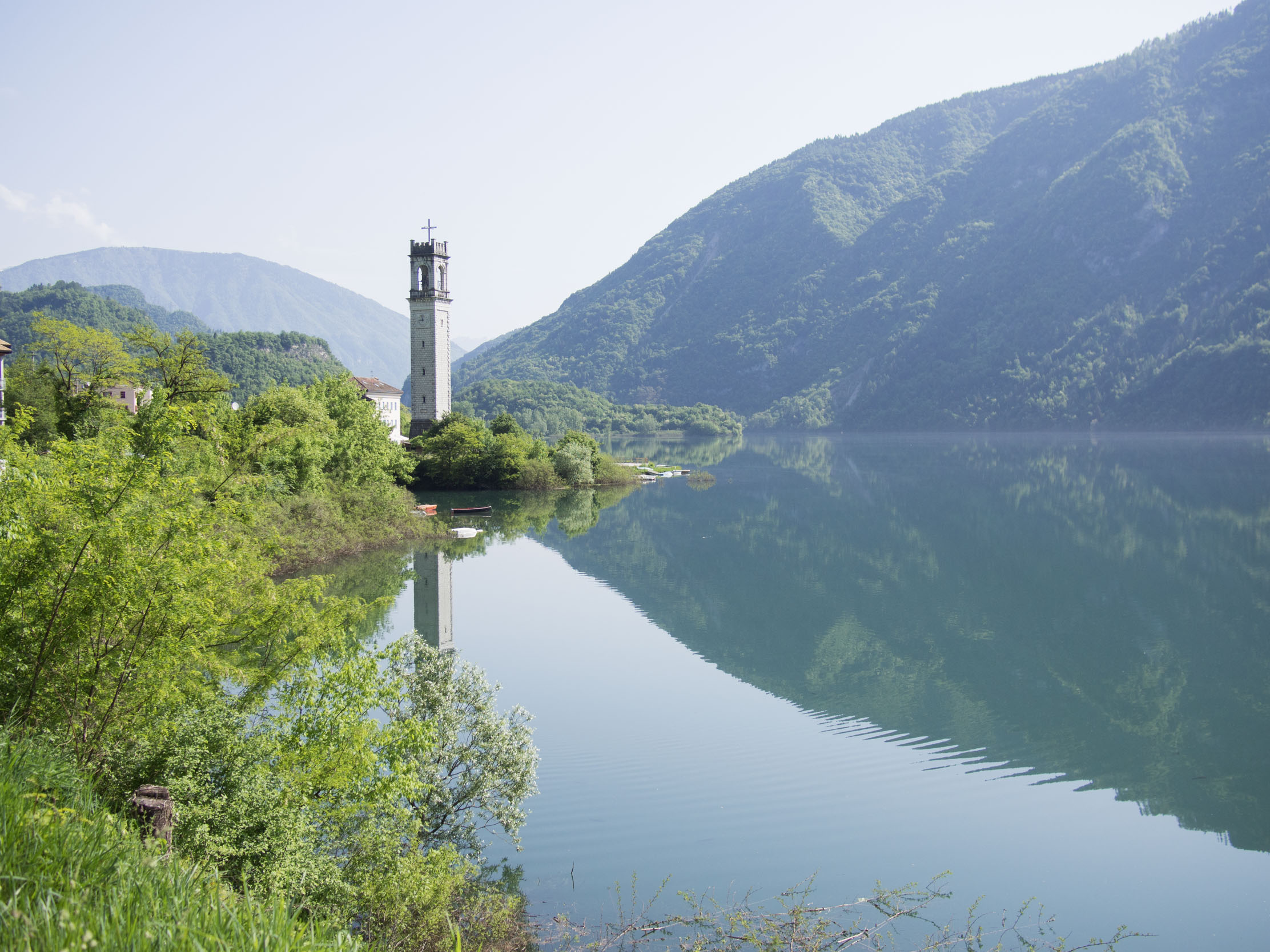View of the campanile of Rocca next to Lake Corlo