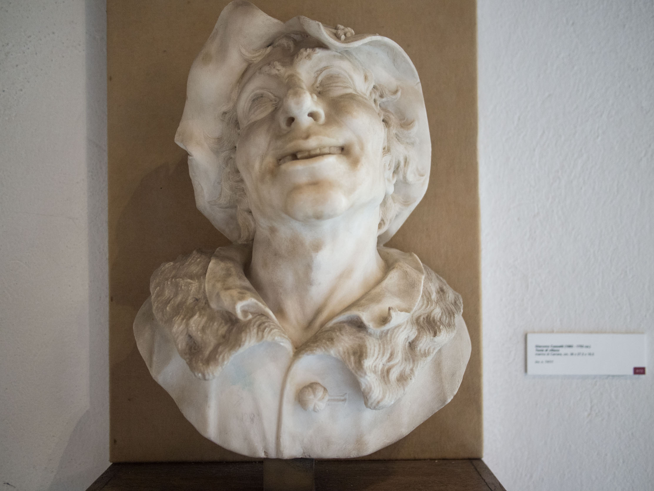 Marble bust of cackling man